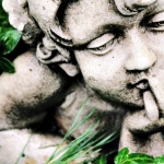 Cherub Statue In Grass