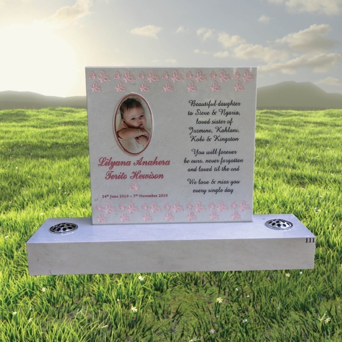 Traditional engraved granite headstone with gilded lettering
